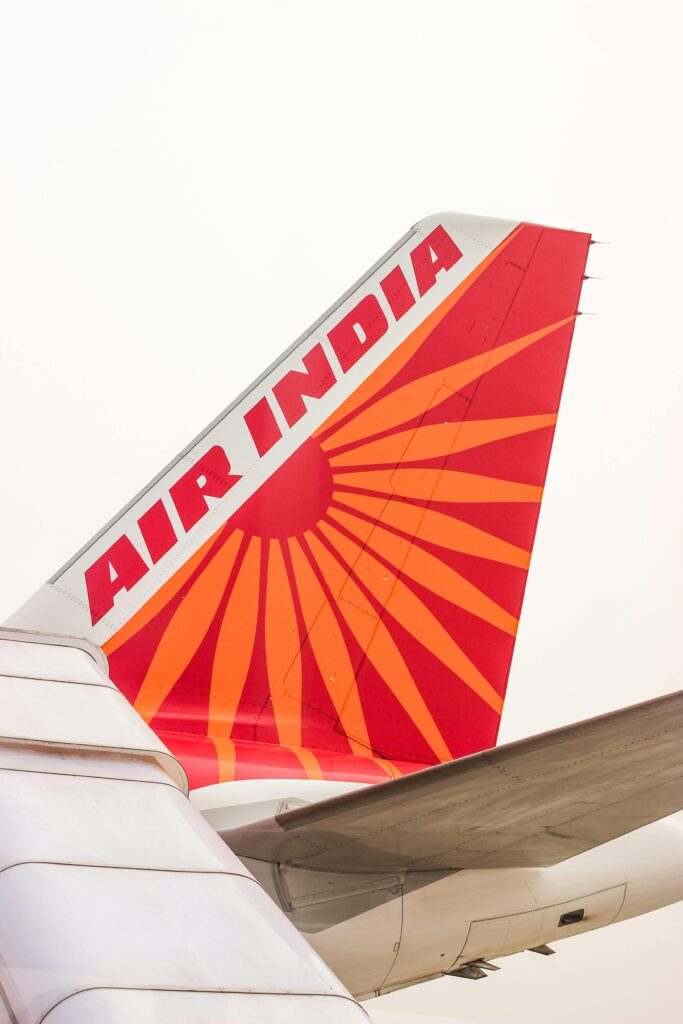 pexels-photo-30002014-30002014 Close-up of Air India's aircraft tail fin featuring the iconic red and orange design.