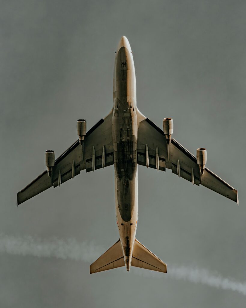 pexels-photo-31719403-31719403 Aerial shot of a commercial airplane soaring against a clear sky, showcasing aviation dynamics.
