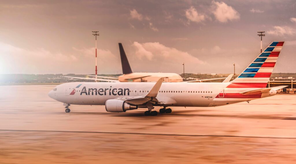 pexels-photo-321159-321159 American Airlines aircraft on the runway at Paris Charles de Gaulle Airport during daylight.